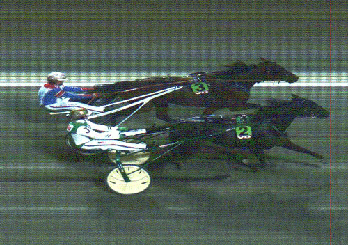 Akerman med Jeppe Juel nรฅr forbi Photo Lavec med Per Oleg Midtfjeld. til sejr i derbyprรธven